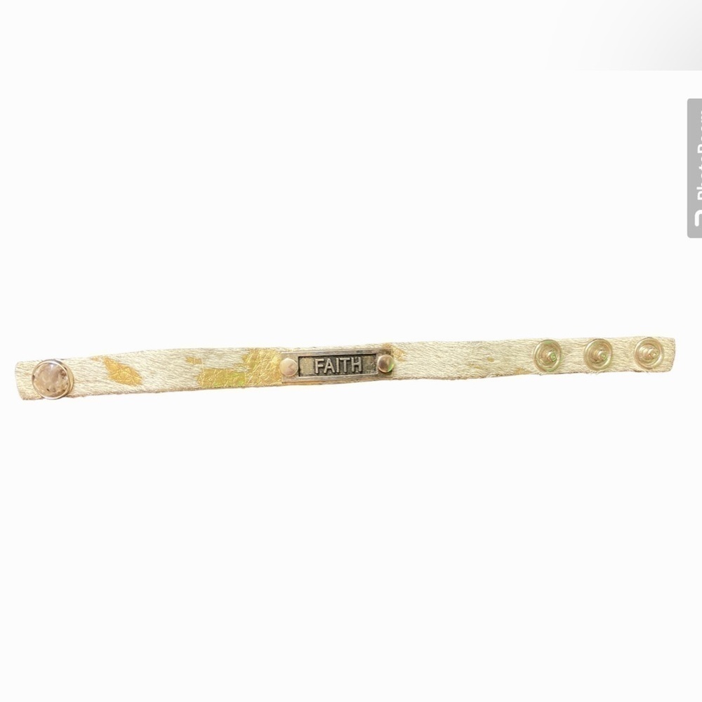 Faith bracelet gold fur leather snap closure.   Box 12